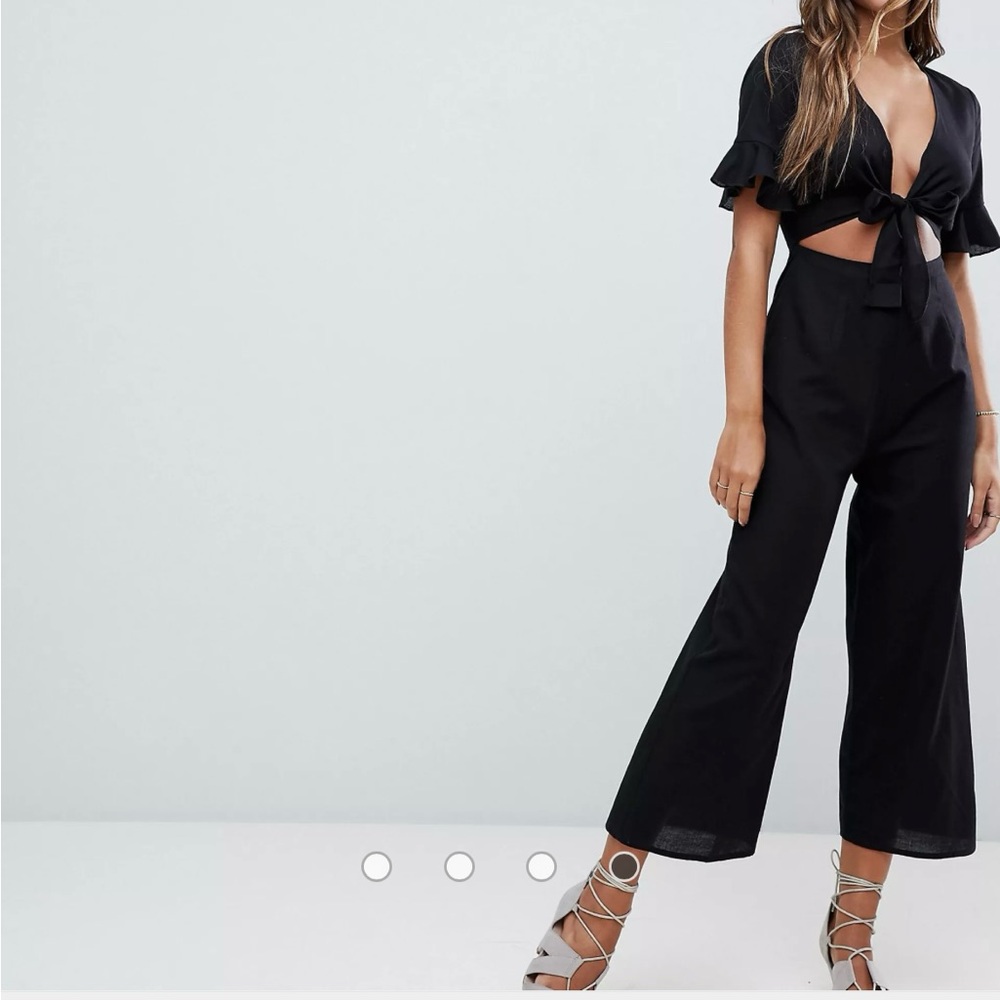 Black linen jumpsuit with cutout and tie front detail